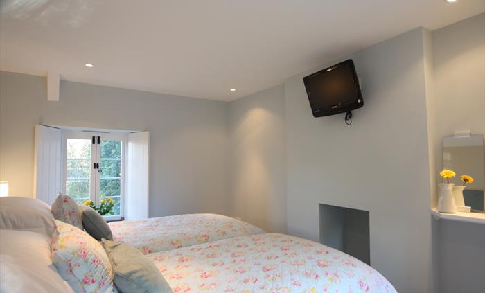 One of the bedrooms here set up as a pair of twin beds